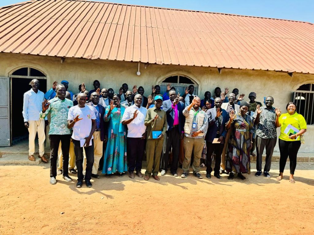 A group of people standing in front of a building